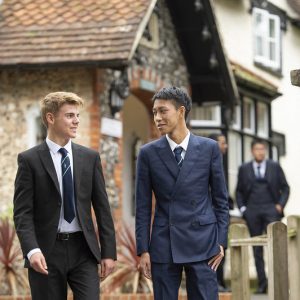 boys in front of school buildings