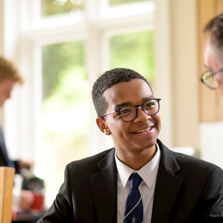 boy talking to his teacher