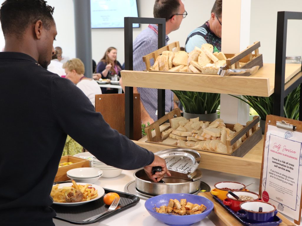 students and teachers picking out their food