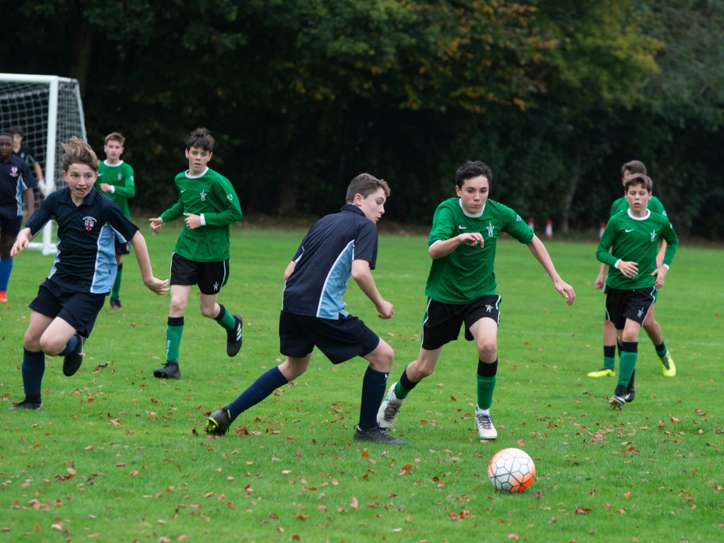 boys playing football