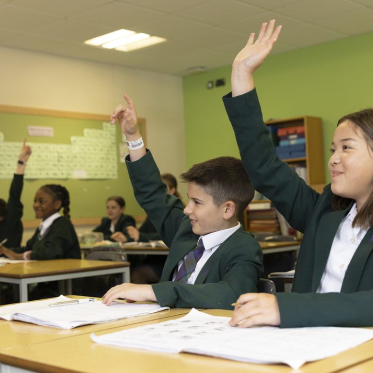 children raising hands