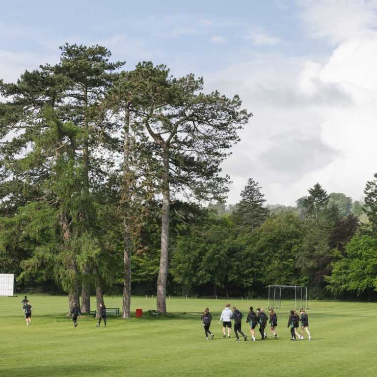 students walking outside on the field