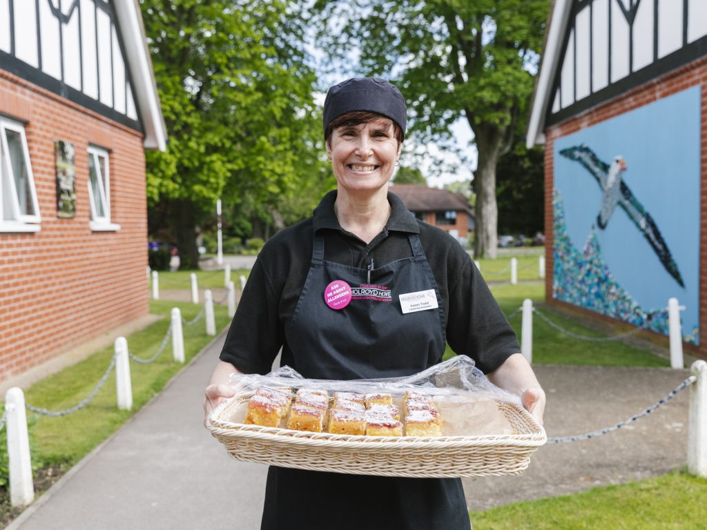 chef with baked cakes