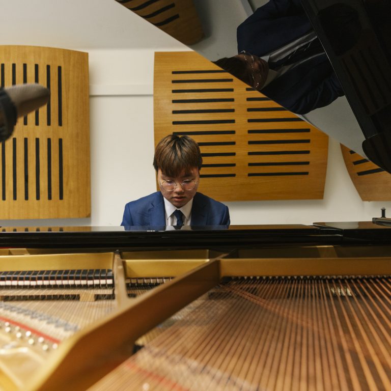 student playing the piano