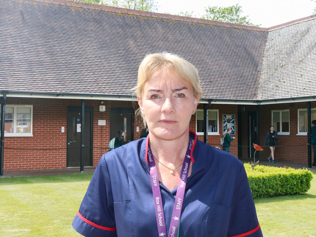 lady wearing a box hill lanyard